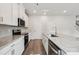 Well-appointed kitchen with granite countertops, stainless steel appliances, and ample storage space in the white cabinets at 1466 31St Ne St, Conover, NC 28613