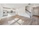 Open-concept living space with modern kitchen, staircase, and lots of light at 1466 31St Ne St, Conover, NC 28613