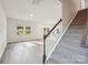 Spacious living room with ample natural light, wood floors, and staircase at 1466 31St Ne St, Conover, NC 28613