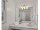 Bright bathroom featuring a large mirror, natural light, and a shower/tub combo at 1624 Chadmore Nw Ln, Concord, NC 28027