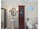 Charming bathroom featuring a pedestal sink, a dark wood cabinet, and a corner shower at 1624 Chadmore Nw Ln, Concord, NC 28027