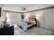 Cozy bedroom features neutral carpet, large windows, and tranquil decor create a peaceful retreat at 1624 Chadmore Nw Ln, Concord, NC 28027