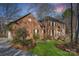 Beautiful brick home with manicured lawn, showcasing architectural details and landscaping, perfect for curb appeal at 1624 Chadmore Nw Ln, Concord, NC 28027