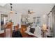 Spacious open floor plan with hardwood floors and a view into the bar, living room, and backyard at 1624 Chadmore Nw Ln, Concord, NC 28027