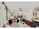 Open living area with hardwood floors, natural light, and access to dining area at 1624 Chadmore Nw Ln, Concord, NC 28027