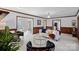 Bright living room with elegant decor, ample seating, and views into adjacent rooms, ideal for entertaining at 1624 Chadmore Nw Ln, Concord, NC 28027