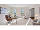 Serene home office bathed in sunlight, featuring a modern desk, comfortable seating, and calming neutral tones at 1624 Chadmore Nw Ln, Concord, NC 28027