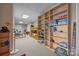 Versatile basement area with bookshelves, bunk beds, and space for play and activities at 16624 Flying Jib Rd, Cornelius, NC 28031