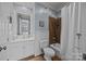 Cozy bathroom with a shower-tub combo, white vanity, and neutral color palette at 16624 Flying Jib Rd, Cornelius, NC 28031