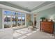 Relaxing bedroom with large windows offering serene waterfront views and soft, natural light at 16624 Flying Jib Rd, Cornelius, NC 28031