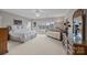 Spacious bedroom featuring a large window with water views, complemented by neutral tones and furnishings at 16624 Flying Jib Rd, Cornelius, NC 28031