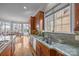 Bright kitchen with granite countertops, stainless steel appliances, and a view of the lake at 16624 Flying Jib Rd, Cornelius, NC 28031