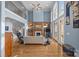 Bright living room with high ceilings, fireplace, and large windows with a view at 16624 Flying Jib Rd, Cornelius, NC 28031