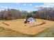 Wide aerial view of a two-story house on a spacious lot with trees at 1695 Agner Rd, Salisbury, NC 28146
