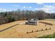 Drone shot of a two-story home with black roof, set on an expansive lawn at 1695 Agner Rd, Salisbury, NC 28146