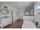 Large primary bathroom with dual vanities, a freestanding tub, and a glass-enclosed shower at 1695 Agner Rd, Salisbury, NC 28146