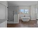 Elegant bathroom featuring a freestanding tub and glass shower with modern finishes and fixtures at 1695 Agner Rd, Salisbury, NC 28146