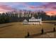 Beautiful two-story modern farmhouse-style home with a landscaped front yard and inviting front porch at 1695 Agner Rd, Salisbury, NC 28146