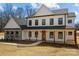 Two-story modern farmhouse with stone accents, a welcoming porch, and a meticulously maintained front lawn at 1695 Agner Rd, Salisbury, NC 28146