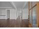 Inviting foyer with wood-look floors, white trim, and paneled door at 1695 Agner Rd, Salisbury, NC 28146