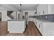 Kitchen with a large island, white cabinets, and stainless steel appliances at 1695 Agner Rd, Salisbury, NC 28146