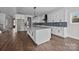 Spacious kitchen with center island, stylish pendant lighting and white cabinetry at 1695 Agner Rd, Salisbury, NC 28146