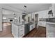 Open concept kitchen with an island, connecting to the fireplace and living area at 1695 Agner Rd, Salisbury, NC 28146