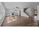 Spacious living room featuring a fireplace, staircase and hardwood floors at 1695 Agner Rd, Salisbury, NC 28146