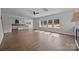 Open-concept living room with bright natural light and hardwood floors connecting to the kitchen at 1695 Agner Rd, Salisbury, NC 28146