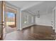 Bright living room features wood floors, a tray ceiling and large windows that let in natural light at 1695 Agner Rd, Salisbury, NC 28146