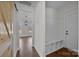 Mudroom with bench, shelving, and a view into the living room at 1695 Agner Rd, Salisbury, NC 28146