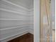 Walk-in pantry with white shelving and a rustic barn door at 1695 Agner Rd, Salisbury, NC 28146