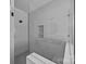 Close-up of a modern shower with white subway tile and a clear glass enclosure, offering a sleek design at 1695 Agner Rd, Salisbury, NC 28146