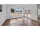 Bright sunroom with wood-look floors and multiple windows offering natural light and serene views at 1695 Agner Rd, Salisbury, NC 28146