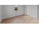 A standard bedroom featuring light-colored walls, trim, and wood flooring at 2418 Acapulco Dr, Gastonia, NC 28054