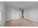 Bedroom featuring light-colored walls, trim, and wood flooring at 2418 Acapulco Dr, Gastonia, NC 28054
