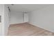 An open and bright bedroom featuring light wood floors and neutral-colored walls at 2418 Acapulco Dr, Gastonia, NC 28054