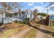 Cozy one-story home featuring gray siding, white trim, and an inviting covered porch area at 2418 Acapulco Dr, Gastonia, NC 28054