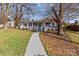 Charming home featuring a covered front porch, walkway, and nicely maintained front yard at 2418 Acapulco Dr, Gastonia, NC 28054