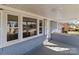 Close up front porch view with white shutters, windows, and a brick facade at 2418 Acapulco Dr, Gastonia, NC 28054