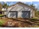 Close up of the garage with two garage bays and a side entrance at 2418 Acapulco Dr, Gastonia, NC 28054