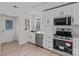 Bright kitchen with white cabinets, stainless steel appliances, and marble-look backsplash at 2418 Acapulco Dr, Gastonia, NC 28054