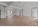 Expansive living room with beamed ceilings, recessed lighting, and light wood flooring at 2418 Acapulco Dr, Gastonia, NC 28054
