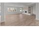 Spacious living room showcasing neutral walls, light wood floors, and a decorative fireplace at 2418 Acapulco Dr, Gastonia, NC 28054