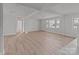 Bright living space with large windows, wood-look floors, and crisp white trim at 2418 Acapulco Dr, Gastonia, NC 28054