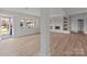 Open living area featuring a decorative fireplace, recessed lighting, and large windows at 2418 Acapulco Dr, Gastonia, NC 28054