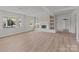 Bright living room featuring hardwood floors, a fireplace, and neutral walls at 2418 Acapulco Dr, Gastonia, NC 28054