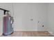 Utility room featuring a newer hot water heater and washer/dryer hookups at 2418 Acapulco Dr, Gastonia, NC 28054