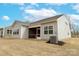 Exterior of home with neutral siding, large screened porch, and well-kept backyard at 244 White Apple Way, Statesville, NC 28625