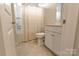 Bathroom featuring a shower and bathtub combination, neutral tile floor, a toilet and a vanity at 244 White Apple Way, Statesville, NC 28625